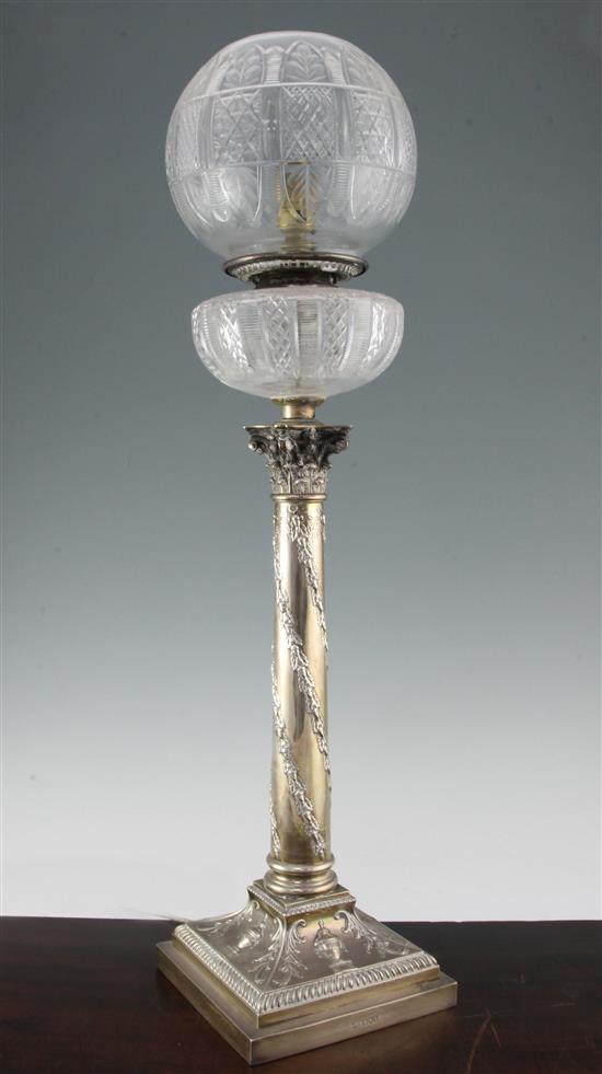 An Edwardian silver corinthian column table oil lamp, overall 29.75in.